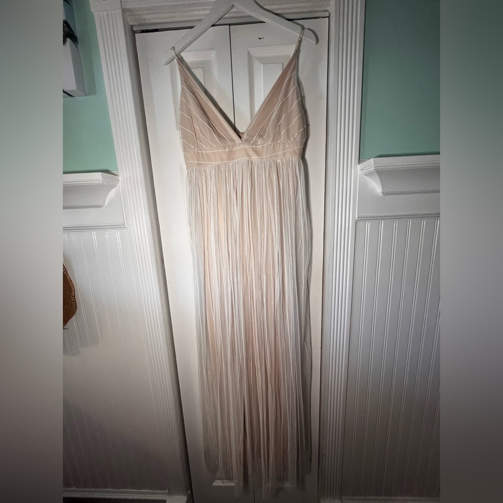 Sheer flowy maxi dress with under layer slits to show off legs